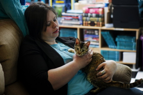 Austin, Minn., author Amanda Hocking at home with her cat. Photo by David Brewster.
